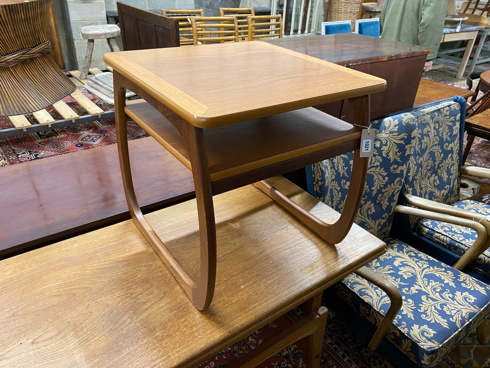 A mid century Trioh type “Copenhagen” metamorphic teak coffee / dining table, width 150cm, depth 54cm, height 72cm and a Nathan teak square occasional table.